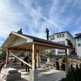 Roofing and framing work on a timber frame outdoor pavilion