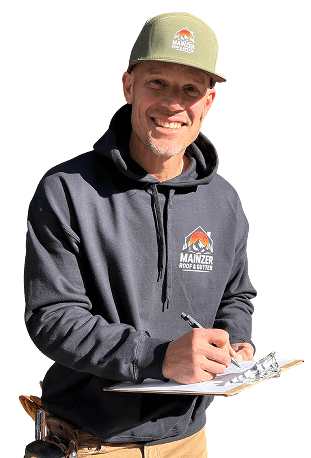roofing contractor Scott Mainzer writing on a paper on a clipboard