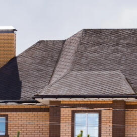 roof of a Colorado home with newly repaired shingles