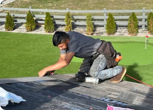 man working on roof repair and maintenance